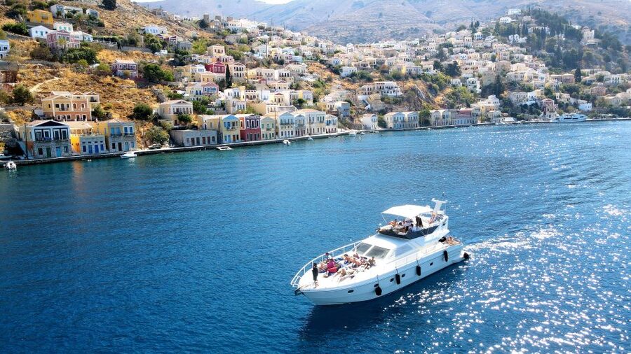 Rhodes: Symi Yacht Tour with Unlimited Drinks and Transfer - St. George Bay combines swimming and lunch