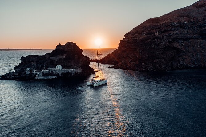 Romantic Sunset Catamaran Caldera Cruise incl. Meal & Drinks - Red Beach and the first look at the caldera