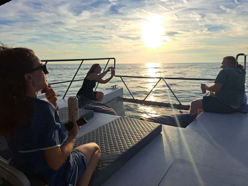 Rovinj: Sunset & dolphin group tours with Catamaran - The first 30 minutes: leaving town and searching for dolphins