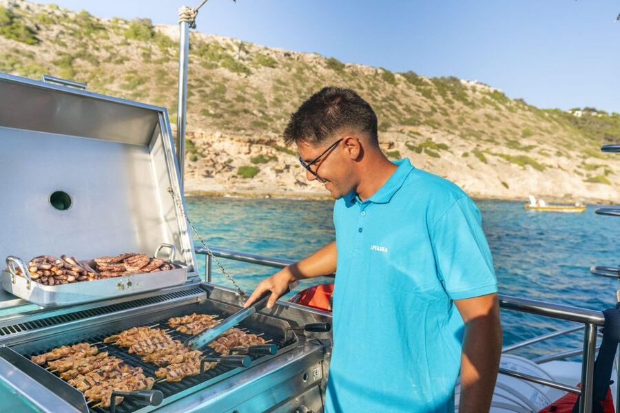 S'Arenal: Sunset Catamaran Cruise with BBQ - The swim stop at Cala Vella