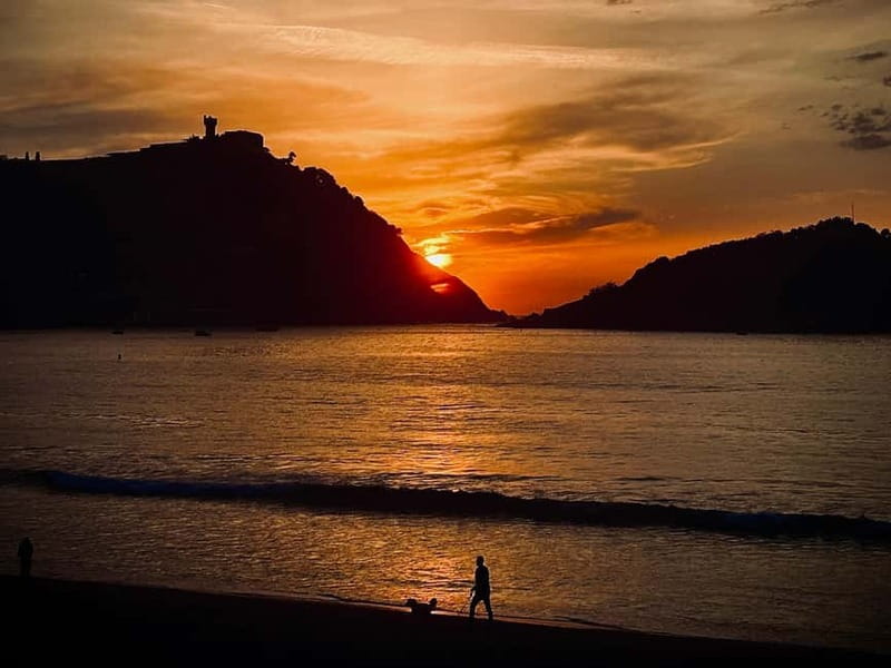 San Sebastián: Sunset Cruise on a Sustainable Catamaran - Santa Clara Island from the water