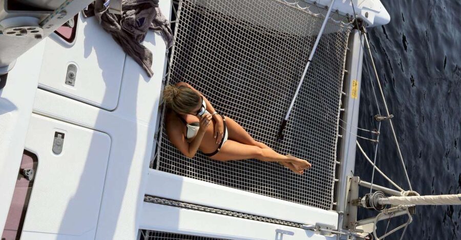 Santorini: 7-Hour Private Catamaran Cruise with Food & Drink - Red Beach and White Beach from the water