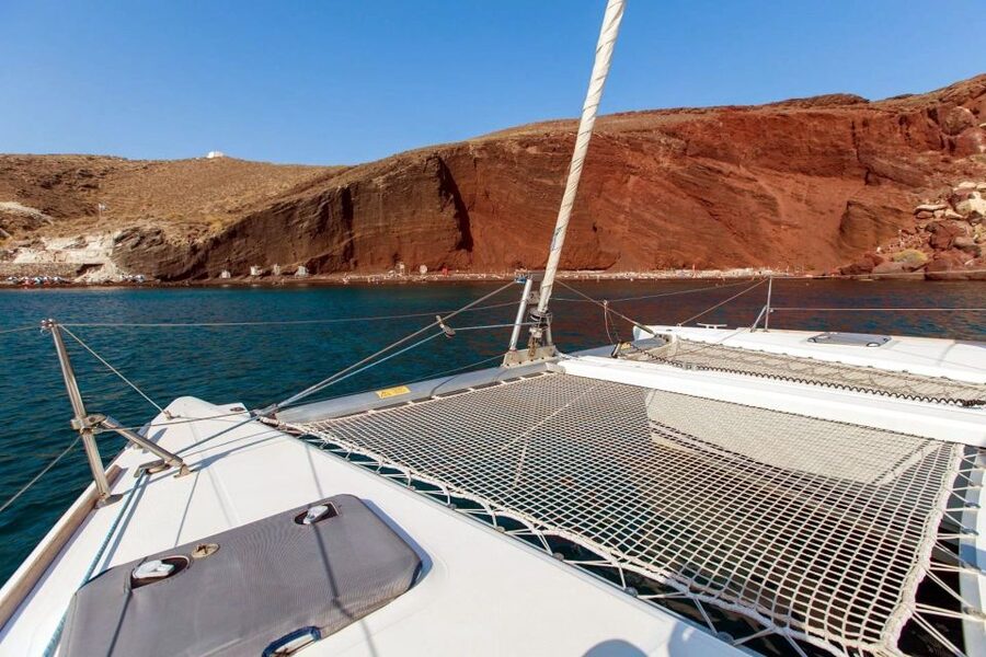 Santorini: 7-Hour Private Catamaran Cruise with Food & Drink - Lighthouse, Aspronisi, and Thirassia