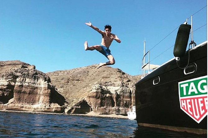 Santorini: Adventurous Catamaran Experience with Snorkeling - Santorini from the water, not the cliff edge