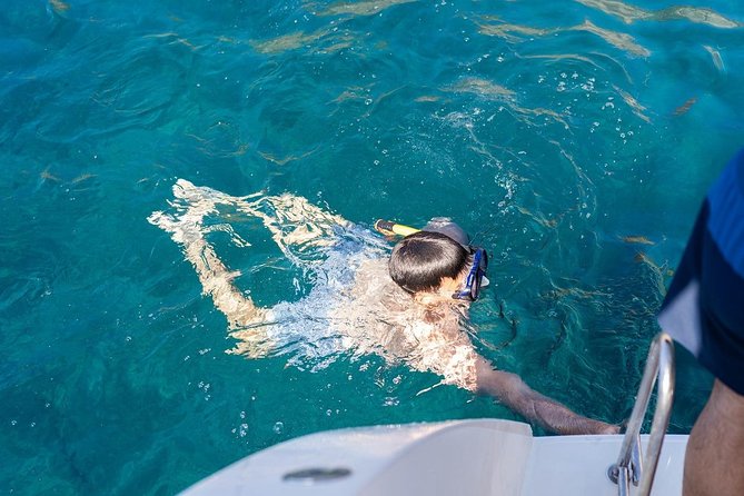 Santorini: Adventurous Catamaran Experience with Snorkeling - White Beach and Black Mountain