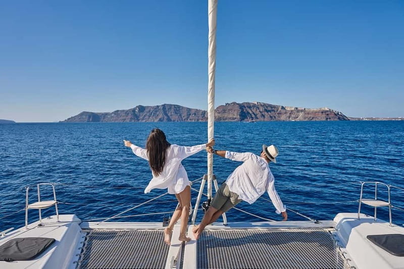 Santorini: Caldera Classic Catamaran Cruise w/ Meal & Drinks - Passing the Akrotiri Lighthouse