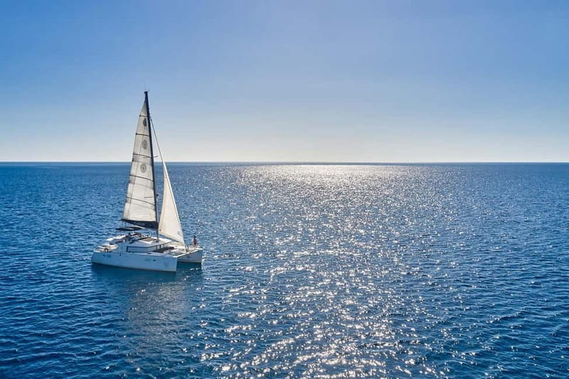 Santorini: Caldera Classic Catamaran Cruise w/ Meal & Drinks - Black lava rock at Nea Kameni
