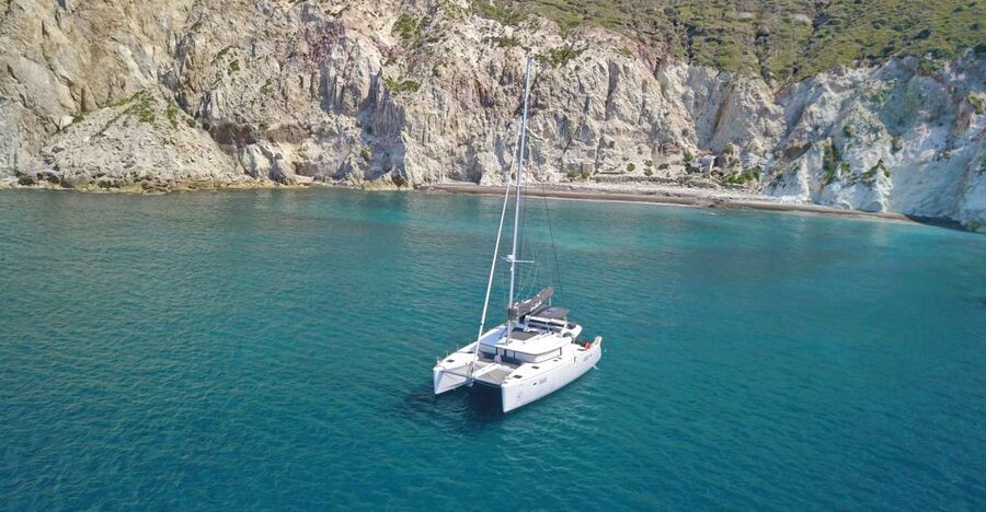 Santorini: Caldera Luxury Catamaran Cruise w/ Meal & Drinks - White Beach and Mesa Pigadia from the water