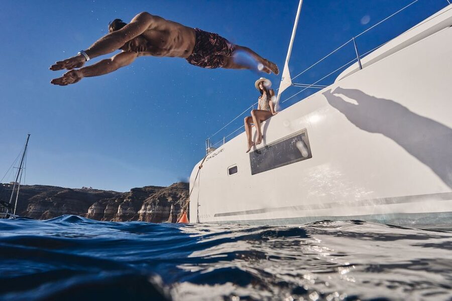 Santorini: Caldera Luxury Catamaran Cruise w/ Meal & Drinks - Pickup from Oia, Fira, and the island’s resort towns