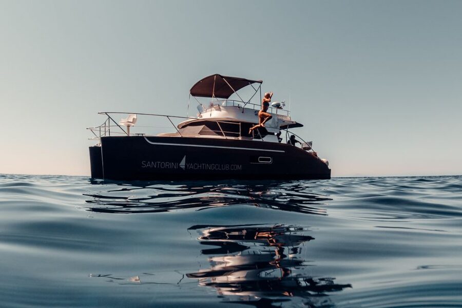 Santorini: Caldera Private Power Catamaran Cruise - Thirassia offers a quieter first stop