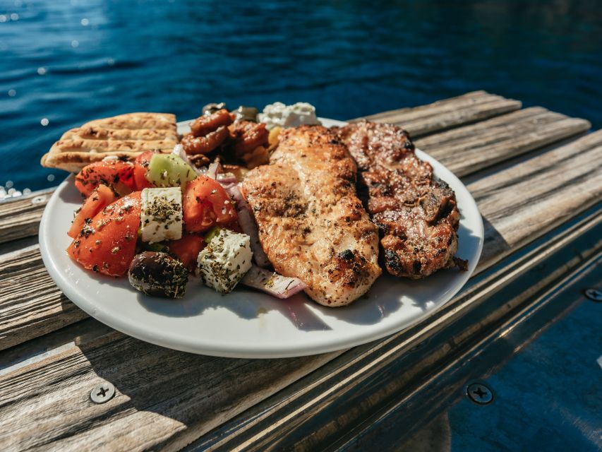 Santorini: Catamaran Caldera Cruise with Meal and Drinks - Seeing Aspronisi, Indian Rock, and the Venetian Lighthouse