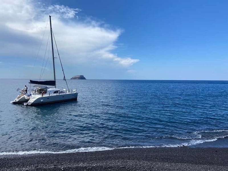 Santorini: Catamaran Cruise with Food and Drinks - Red Beach and the first swim