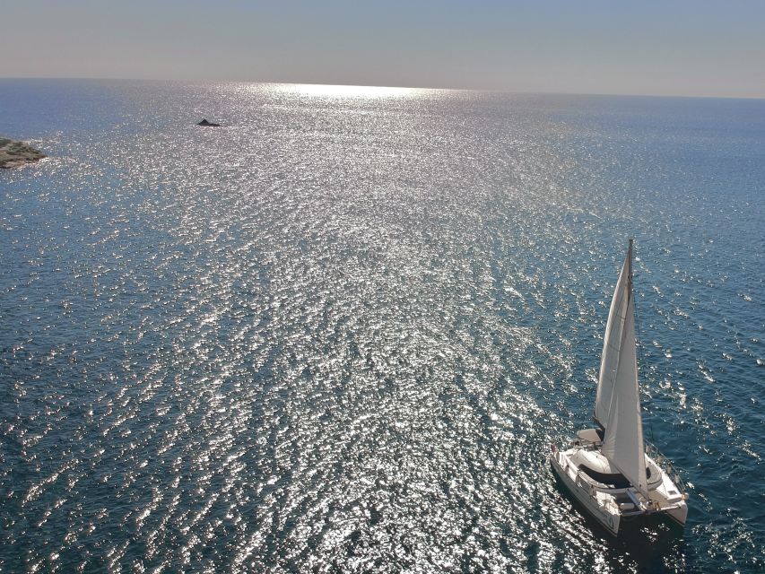 Santorini: Catamaran Cruise with Food and Drinks - Sailing through the volcanic caldera