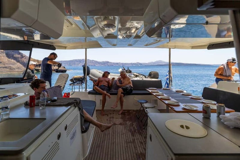 Santorini: Catamaran Cruise with Fresh Meal & Open Bar - Sunset, wind, and the limits of the route