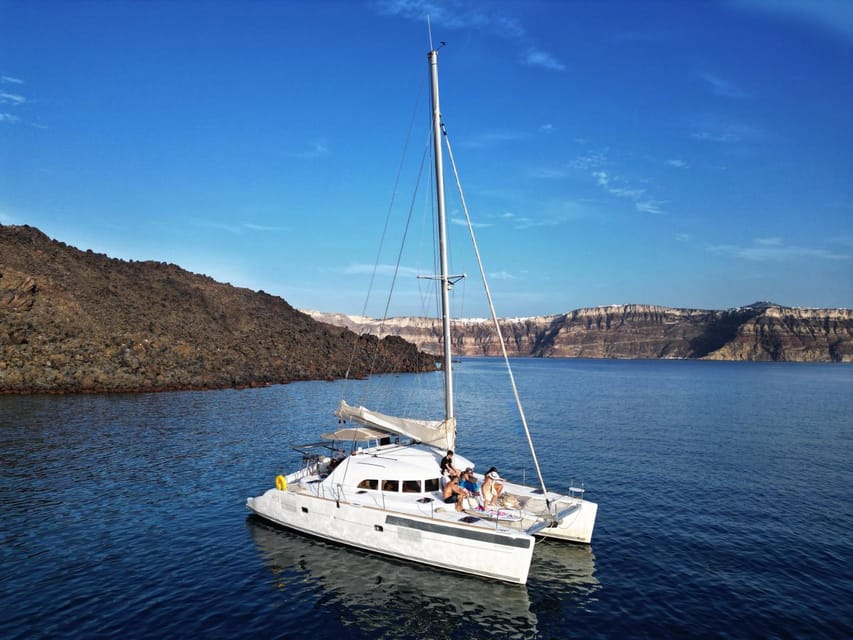 Santorini: Catamaran Cruise with Greek BBQ and Drinks - Greek BBQ, wine, and an open bar