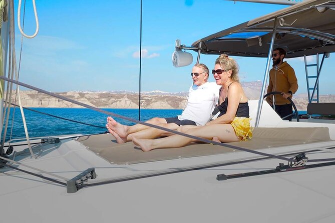 Santorini Catamaran Cruise with Greek Meal, Open-Bar and Sunset - The Luxury Route Beneath Oia