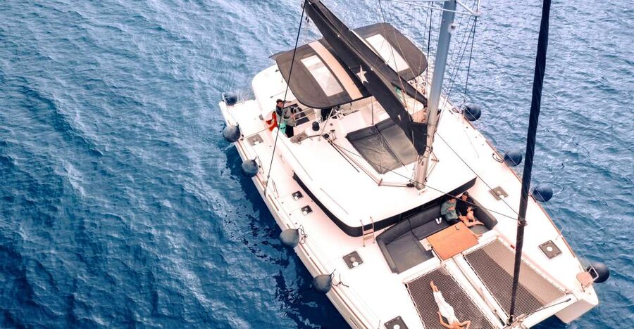 Santorini: Catamaran Cruise with Lunch, Drinks, & Oia Visit - Pickup, Oia, and getting ready to sail