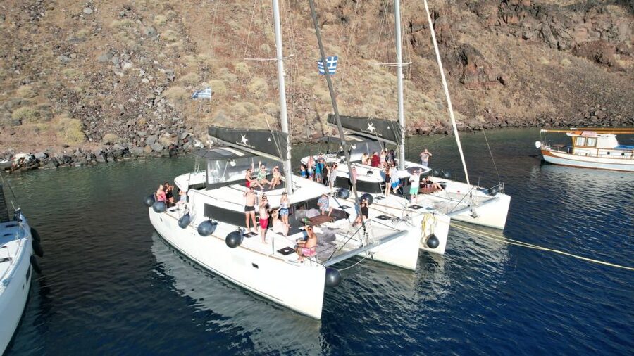 Santorini Catamaran Cruise with Swimming, Meal and Open Bar - Akrotiri Lighthouse and the southern caldera