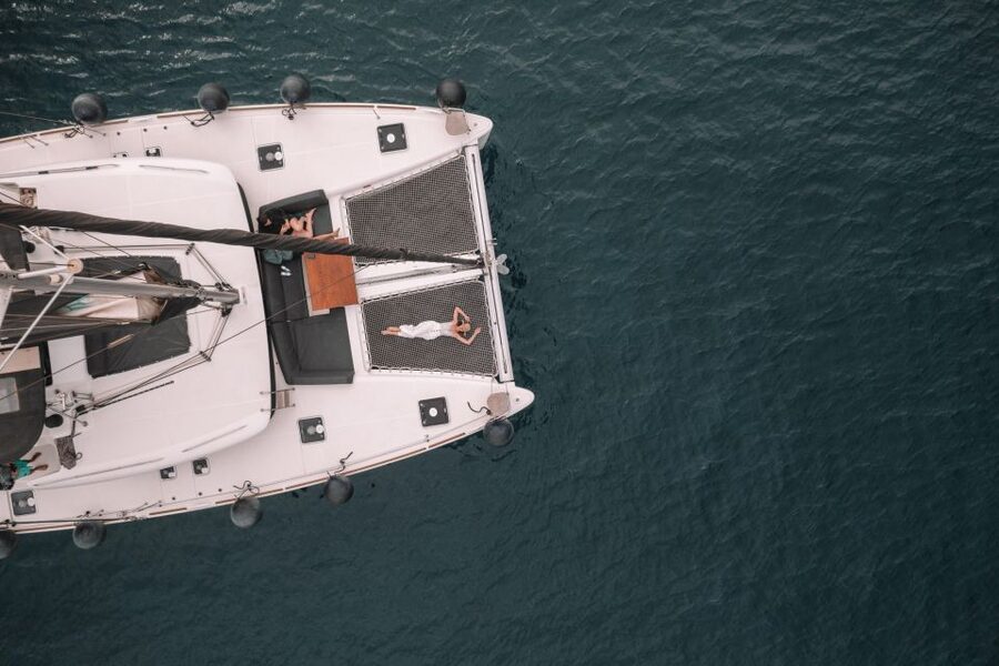 Santorini Catamaran Cruise with Swimming, Meal and Open Bar - Red Beach and White Beach from the sea