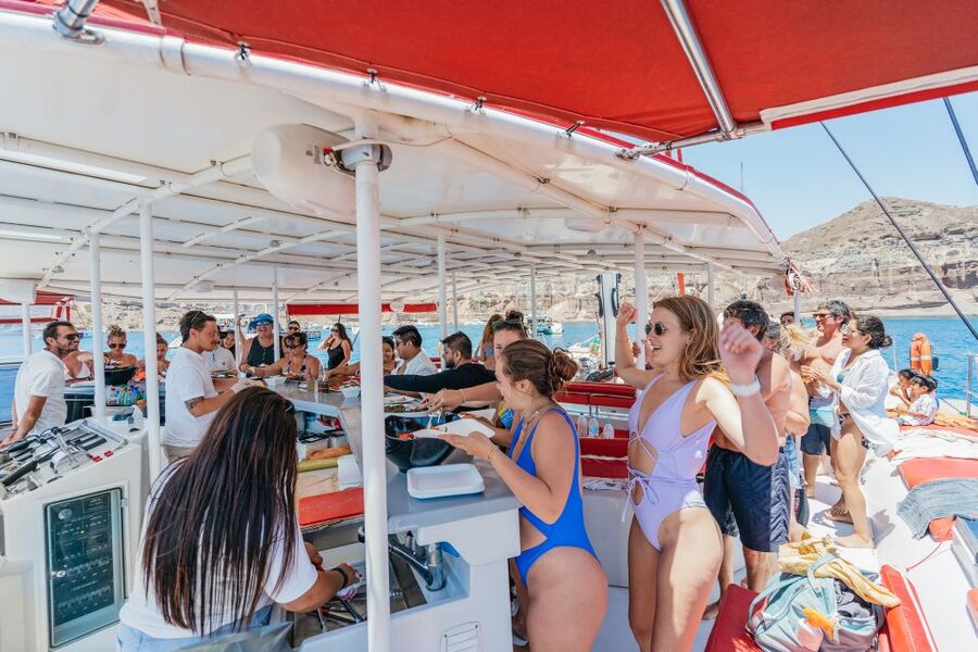 Santorini: Catamaran Tour with BBQ Dinner, Drinks, and Music - Music, dancing, and the right mood