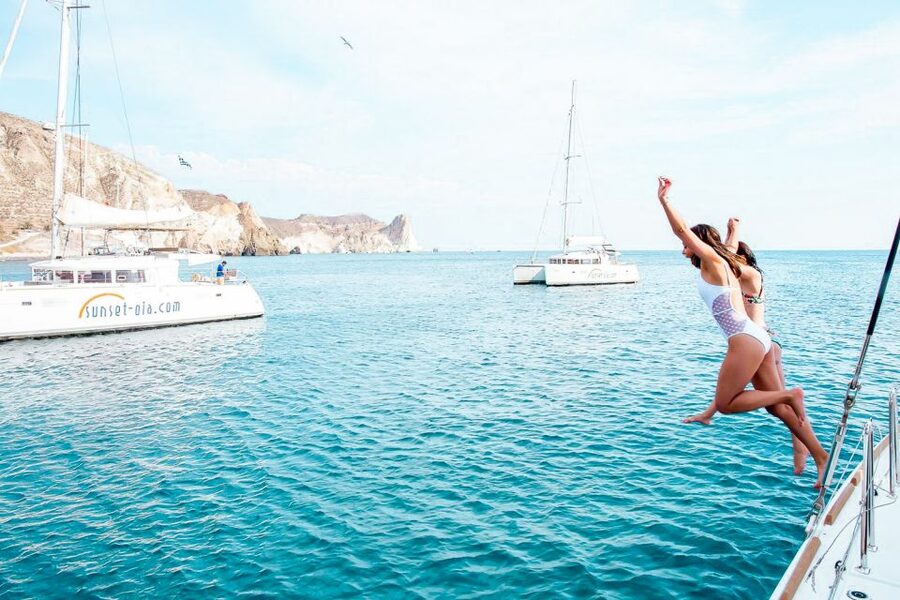 Santorini: Catamaran Tour with BBQ Meal and Unlimited Drinks - Weather, motion, and who will enjoy this most
