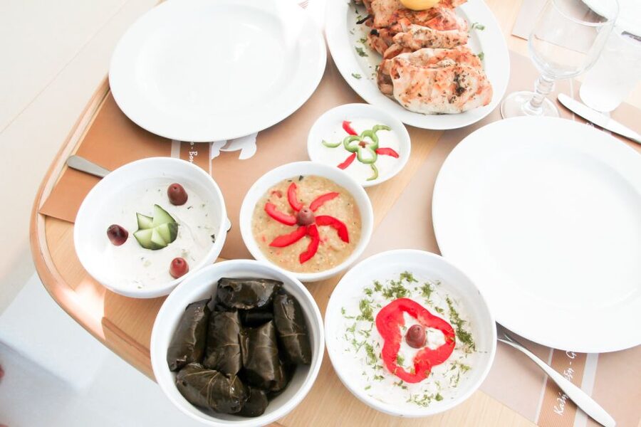 Santorini: Catamaran Tour with BBQ Meal and Unlimited Drinks - White Beach, lunch, and the best reason to stay aboard