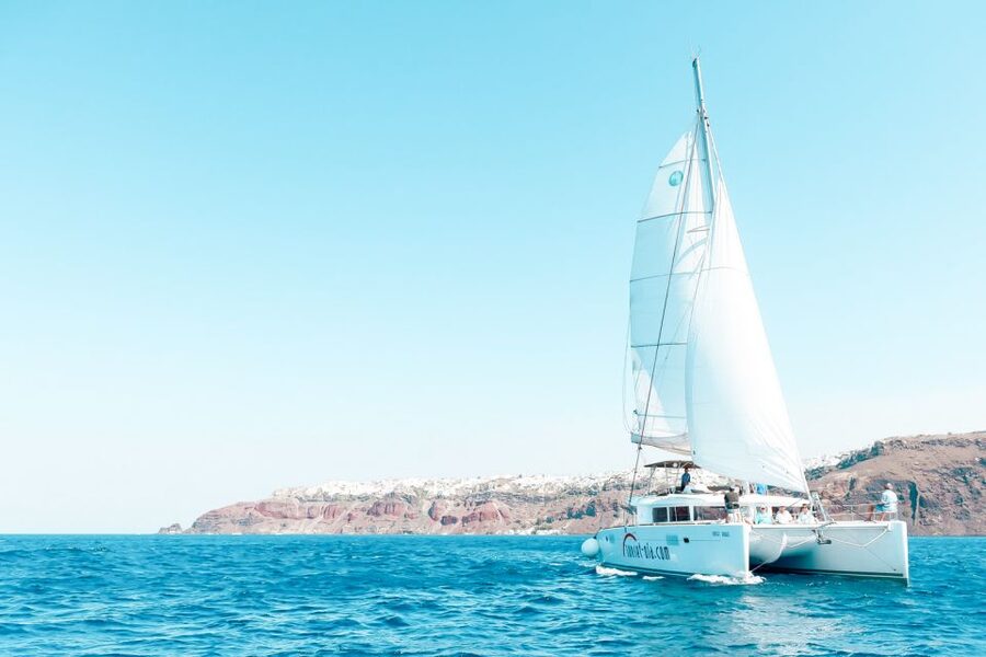 Santorini: Catamaran Tour with BBQ Meal and Unlimited Drinks - Red Beach and snorkeling from the catamaran