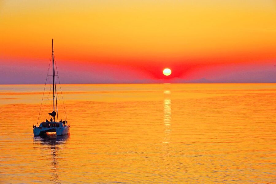 Santorini: Catamaran Tour with BBQ Meal and Unlimited Drinks - Choosing between the morning and sunset cruise