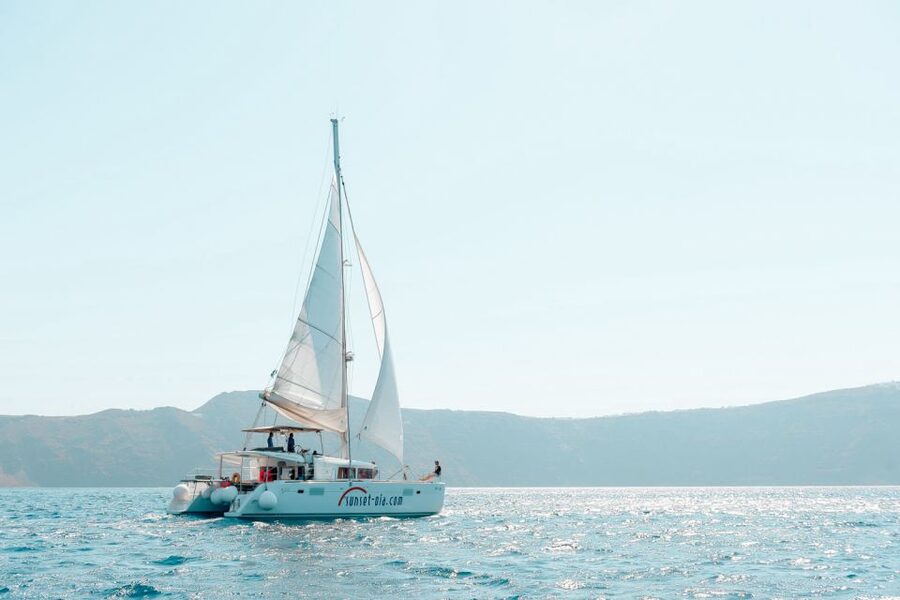 Santorini: Catamaran Tour with BBQ Meal and Unlimited Drinks - Crew service and onboard comfort