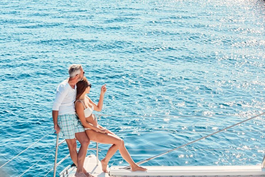 Santorini: Catamaran Tour with BBQ Meal and Unlimited Drinks - Pickup, ports, and the five-hour schedule