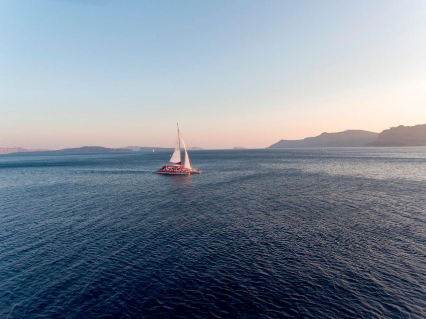 Santorini: Cruise Catamaran with BBQ & Drinks Day or Sunset - Sailing past Nea Kameni and the hot springs