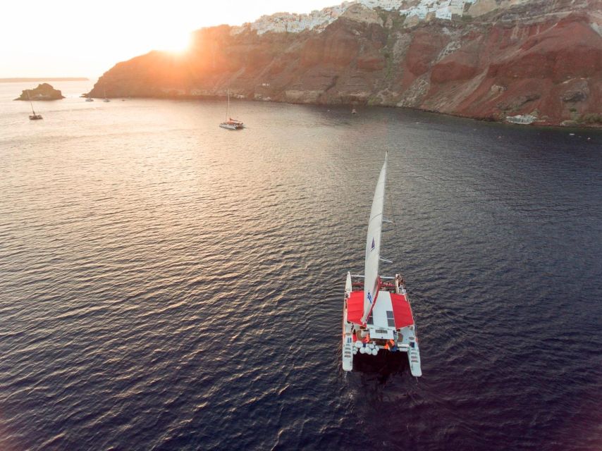 Santorini: Cruise Catamaran with BBQ & Drinks Day or Sunset - White Beach and the onboard Greek BBQ