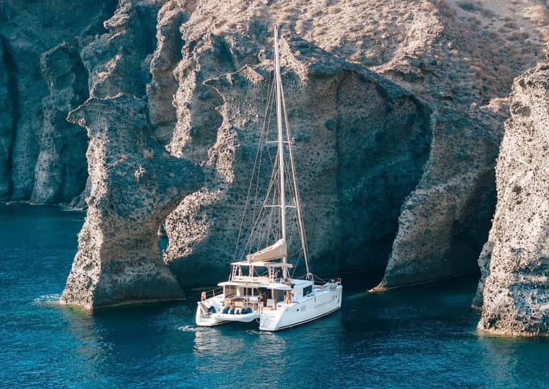 Santorini: Luxury Catamaran Cruise with Lunch, BBQ & Drinks - Mesa Pigadia brings the first real swim stop