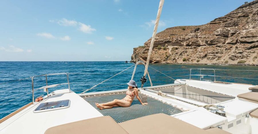 Santorini: Luxury Catamaran Day Trip with Meal and Open Bar - Pickup, port transfer, and boarding details