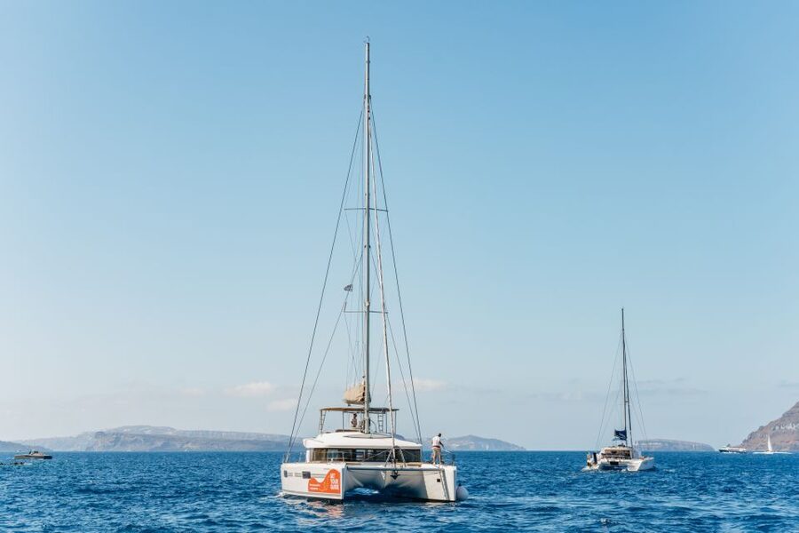 Santorini: Luxury Catamaran Day Trip with Meal and Open Bar - Red Beach and the first swim stop