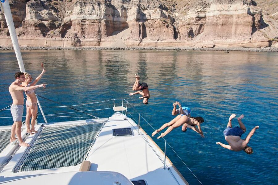Santorini: Platinum Catamaran Cruise w/ BBQ Meal & Open Bar - Red Beach and the volcanic coast