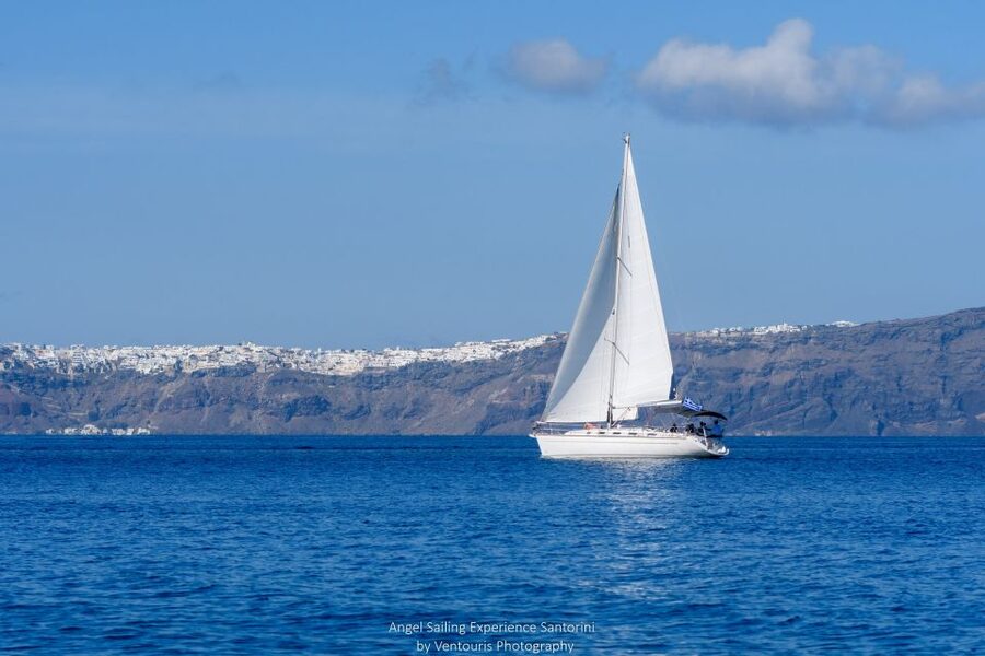 Santorini: Private 5-Hour Sunset Sailing Tour with Dinner - The lighthouse, hot springs, and the volcanic caldera