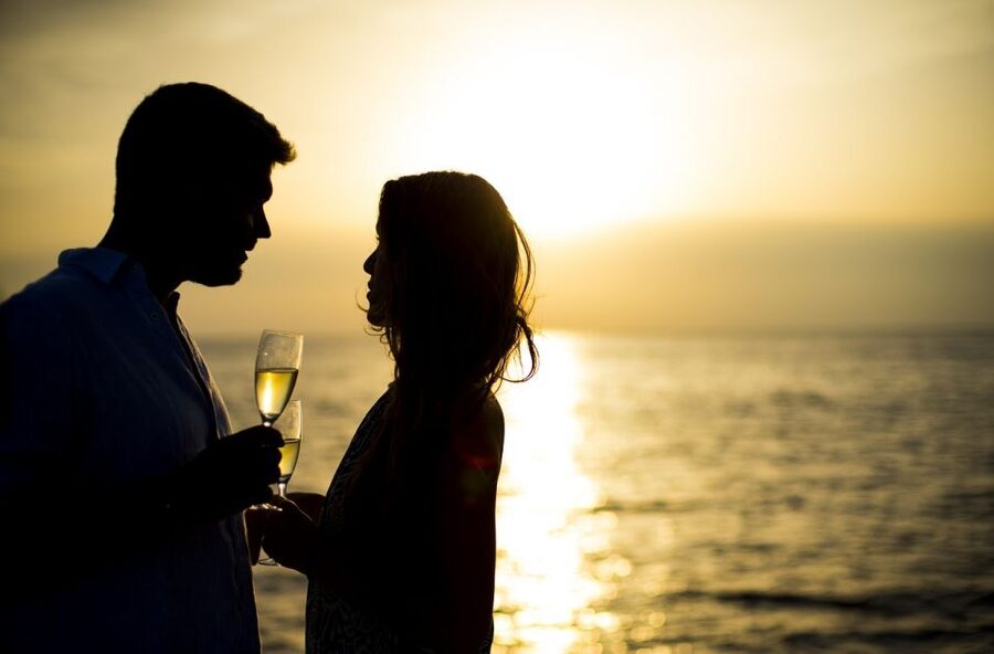 Santorini: Private Catamaran Cruise with BBQ Meal and Drinks - Sailing beneath the caldera cliffs