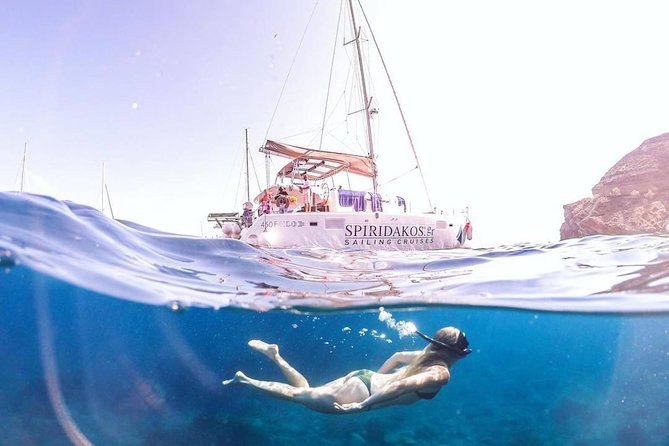 Santorini Private Catamaran Cruise with BBQ, Open Bar & Transfers - Red Beach: a quick look at Santorini’s iron-red coast