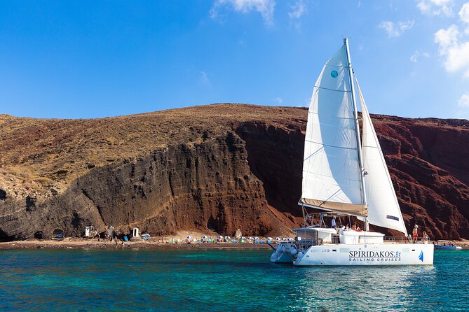 Santorini Private Catamaran Cruise with BBQ, Open Bar & Transfers - White Beach and Mesa Pigadia: the best time for swimming