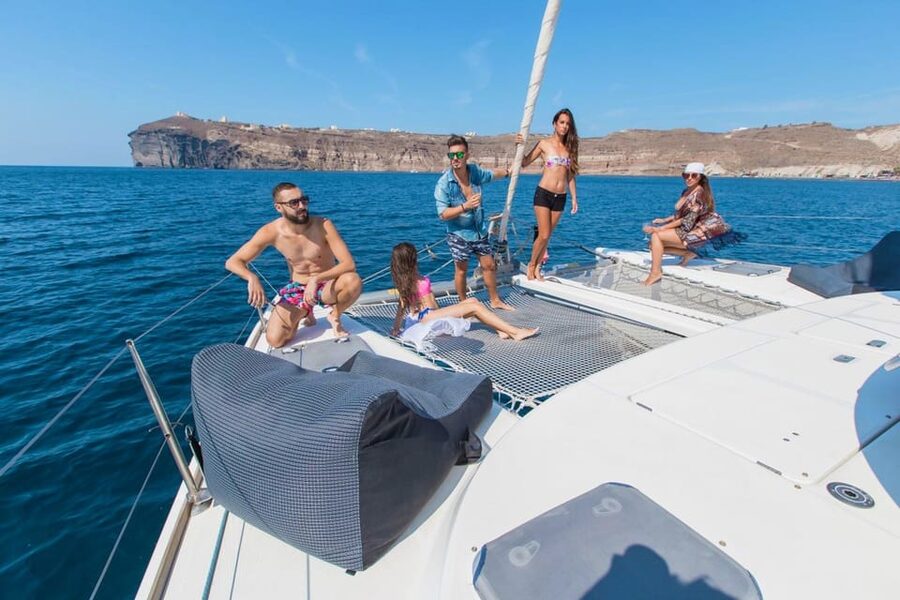 Santorini: Private Catamaran Cruise with Food & Drinks - What weather can change