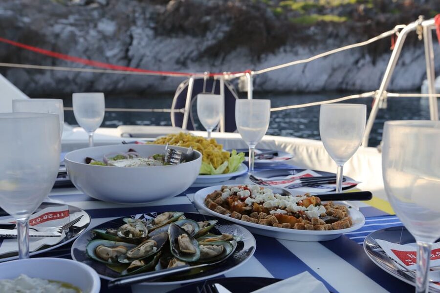 Santorini: Private Catamaran Cruise with Food & Drinks - Lighthouse, Aspronisi, and the volcanic islands
