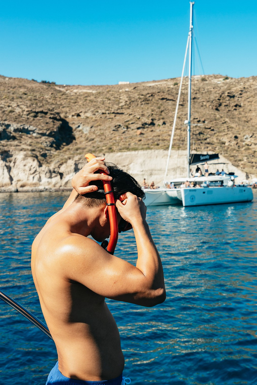 Santorini: Private Catamaran Tour with BBQ Meal and Drinks - Red Beach and the volcanic coast