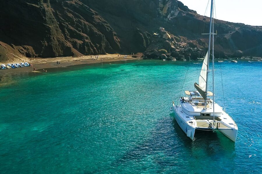 Santorini: Private Catamaran Tour with BBQ Meal and Drinks - The final swim, Thirasia, and the return