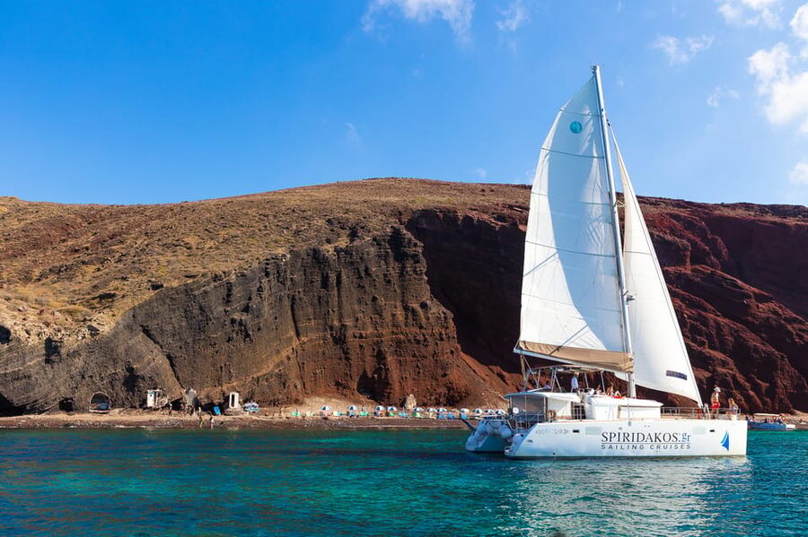 Santorini: Sailing Catamaran Cruise with BBQ and Drinks - Red Beach and White Beach from the sea