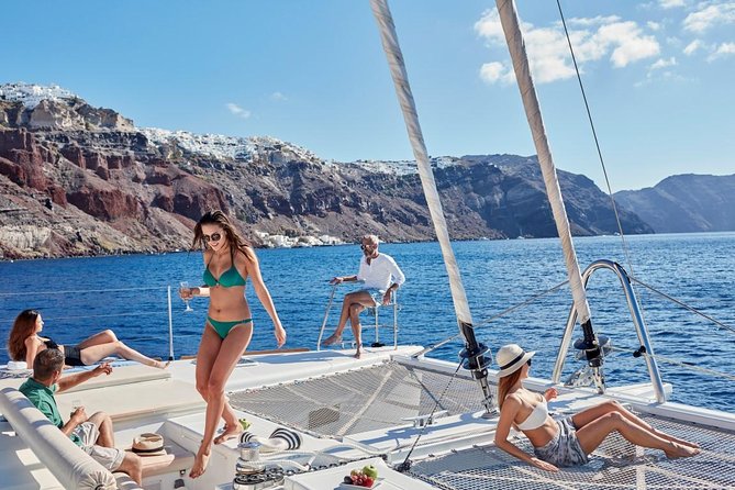 Santorini Sunset Luxury Sailing Catamaran Cruise with BBQ, drinks, transfer - Red Beach gives you a quick first swim