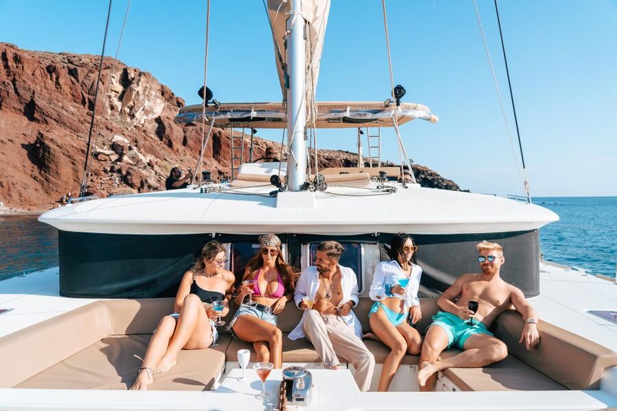 Santorini: Sunset Sailing Cruise, with Dinner and Drinks - Red Beach gives the cruise an active start