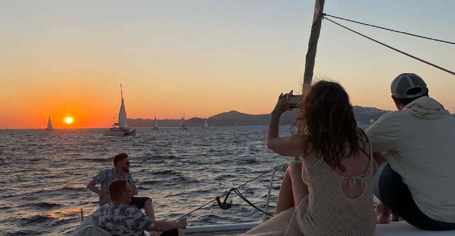 Santorini: Sunset Sailing Cruise, with Dinner and Drinks - Watching sunset from the Aegean