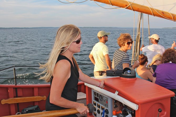 Schooner Fame Sailing Tour - Helping hoist the sails and steer the ship