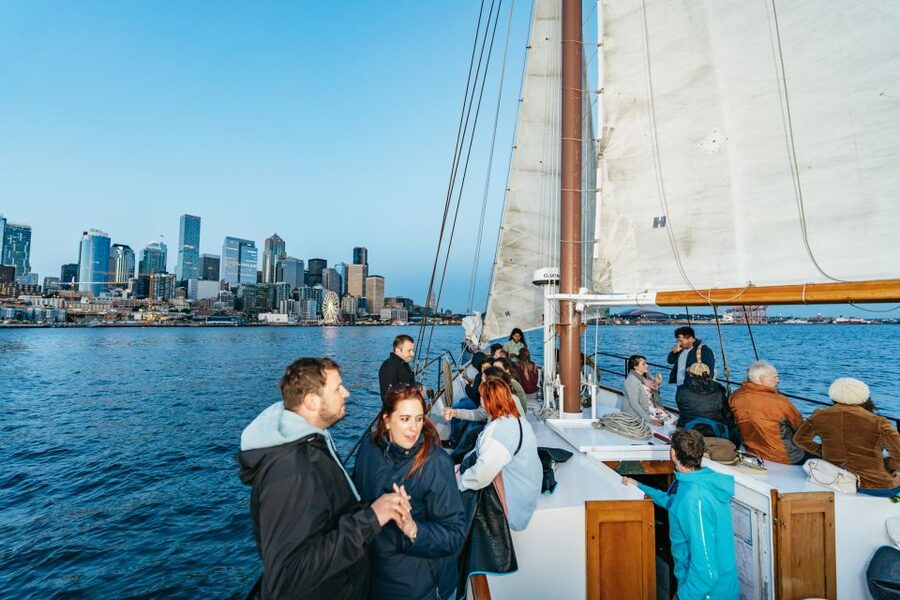 Seattle: Tall Sailboat Sunset Harbor Cruise - Raising sails and taking the wheel